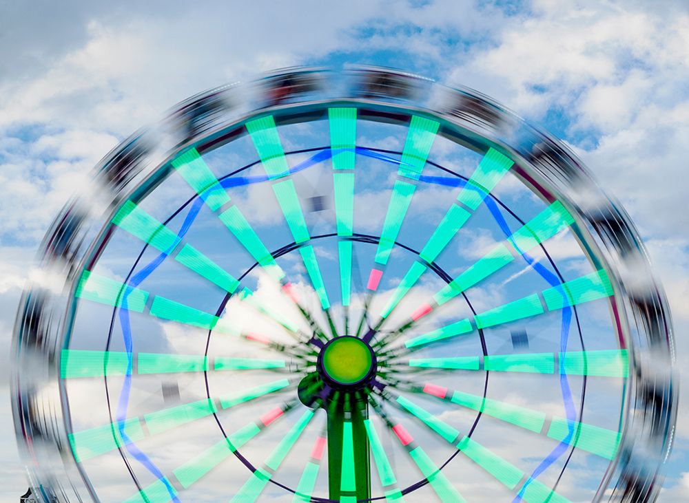 Motion blur of a Ferris wheel. art print by Merrill Images for $57.95 CAD