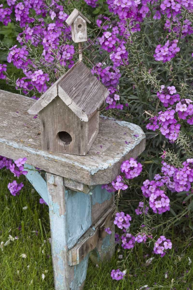 Bird houses on bench next to garden flowers art print by Don Paulson for $57.95 CAD