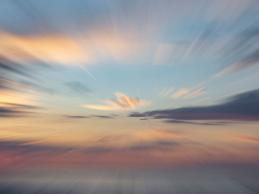 Zoom-blur image of sunset sky. art print by Merrill Images for $57.95 CAD