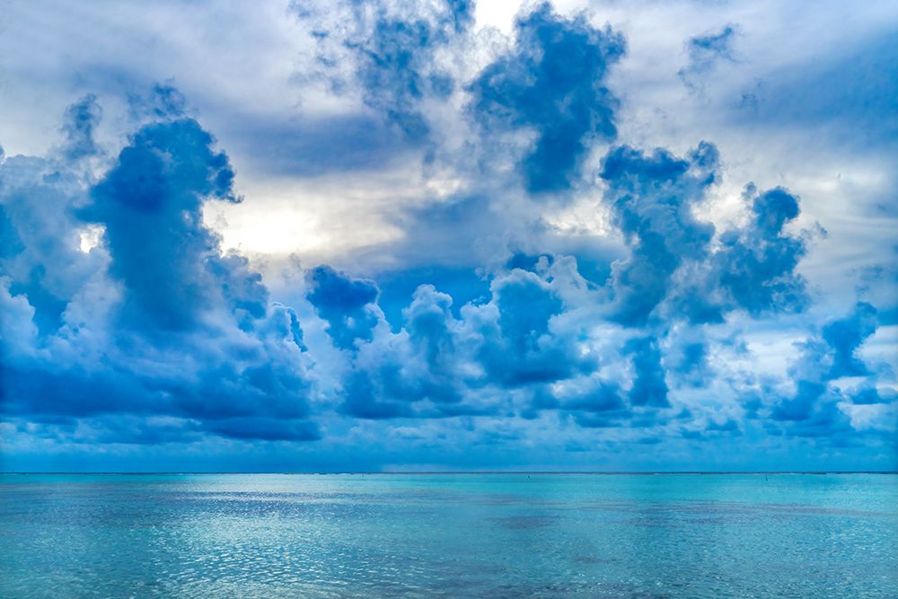 Cloudscape-Moorea-Tahiti-French Polynesia. Blue colors in water in lagoon and coral reefs art print by William Perry for $57.95 CAD