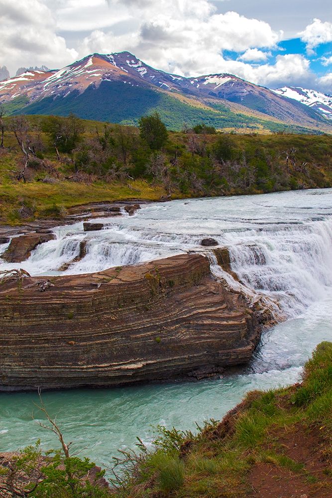 Located with Parc Nacional Torres del Paine-this lake has a runoff through rocks creating rapids art print by Mallorie Ostrowitz for $57.95 CAD