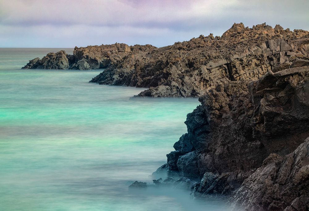 Lava rocks along tranquil shoreline of San Cristobal Island-Galapagos-Ecuador art print by Adam Jones for $57.95 CAD