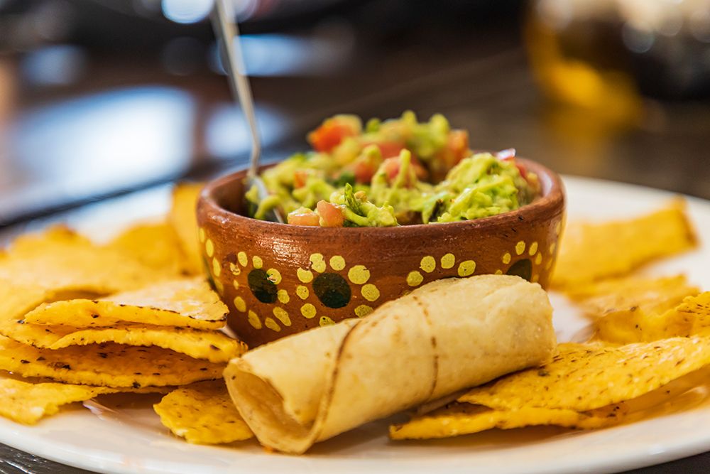 San Ignacio- Mulege- Baja California Sur- Mexico. Chips and guacamole in a cafe in San Ignacio. art print by Emily Wilson for $57.95 CAD