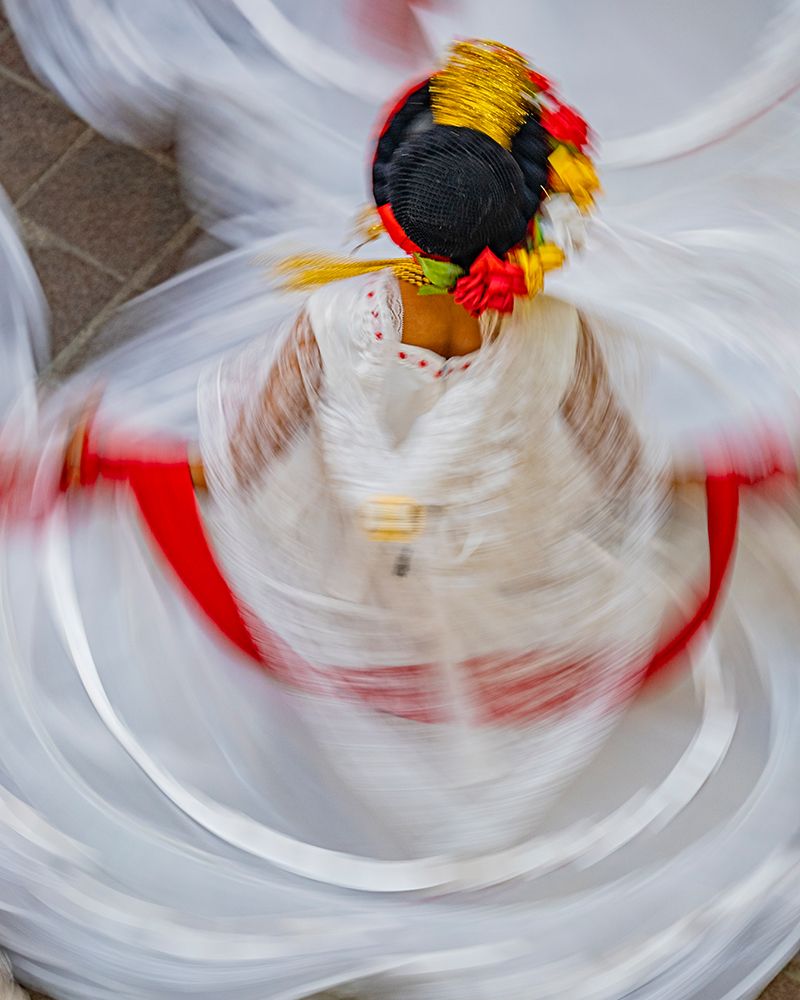 Mexico, San Miguel de Allende. Blurred motion view of woman dancing. art print by Merrill Images for $57.95 CAD