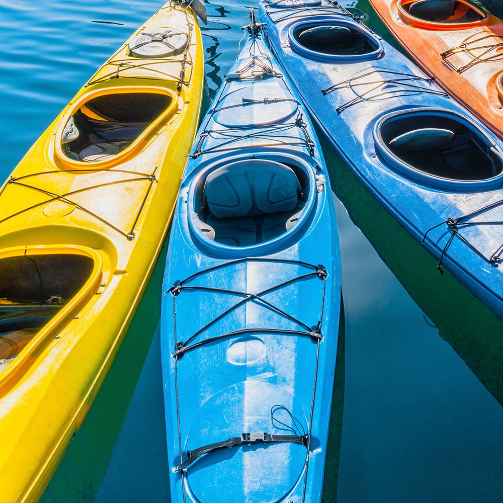 Four colorful kayaks positioned in an array. art print by Janet Muir for $57.95 CAD