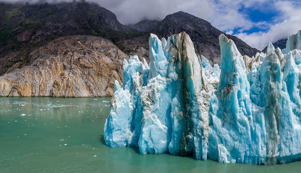 Alaska-Tracy Arm-Fords Terror Wilderness-Aerial view of blue face of Dawes Glacier art print by Paul Souders for $57.95 CAD