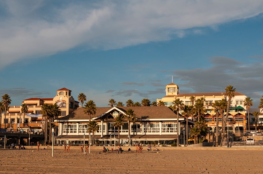 Volleyball players on Huntington Beach fronting sunlit waterfront buildings California-USA art print by Sergio Pitamitz for $57.95 CAD