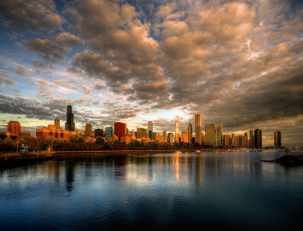 Chicago skyline shimmers at sunrise over lake Michigan art print by Steve Mohlenkamp for $57.95 CAD