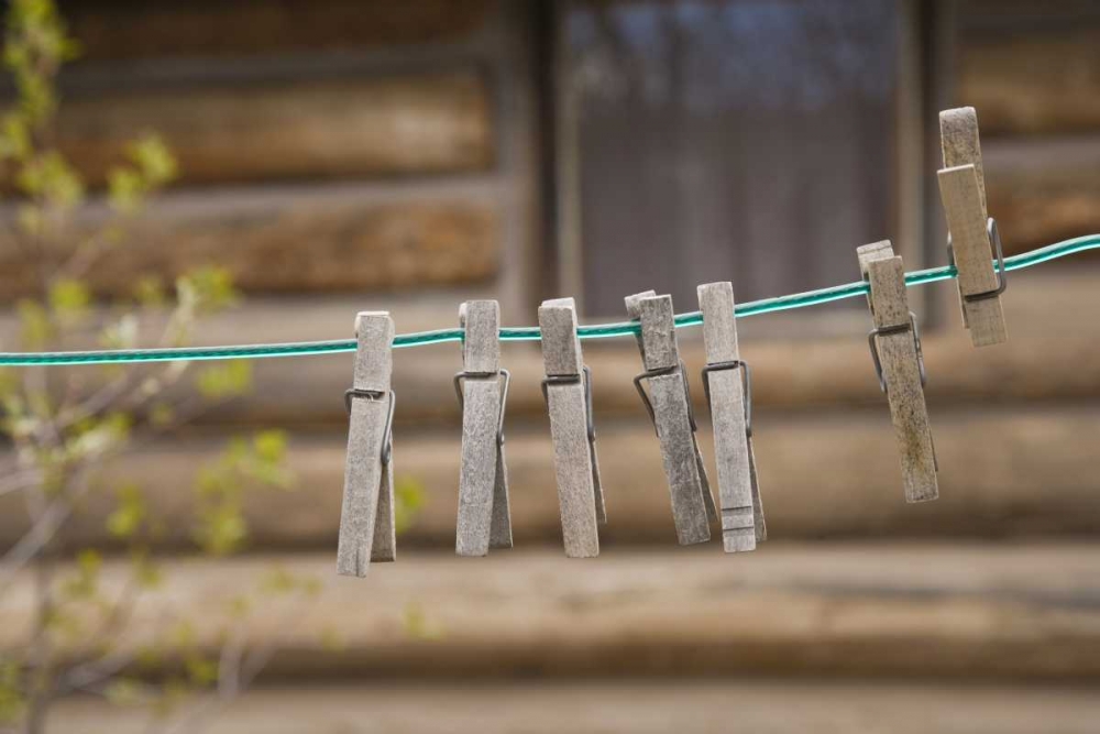 MT, Clothes pins on a clothesline by a log cabin art print by Don Paulson for $57.95 CAD
