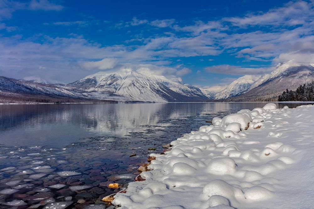 Mountains reflect in wintry Lake McDonald in Glacier National Park-Montana-USA art print by Chuck Haney for $57.95 CAD