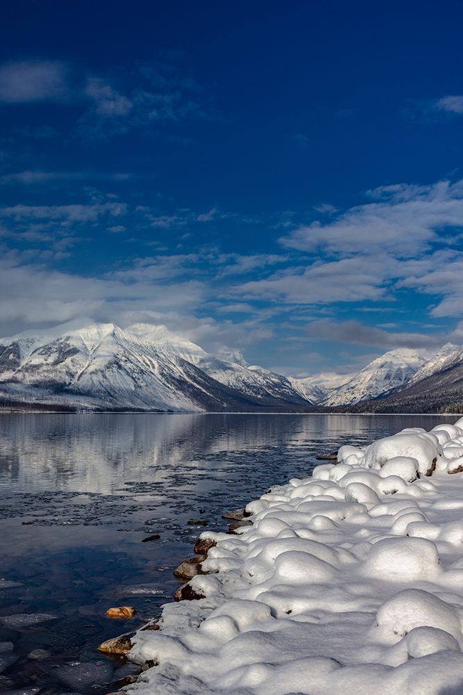 Mountains reflect in wintry Lake McDonald in Glacier National Park-Montana-USA art print by Chuck Haney for $57.95 CAD