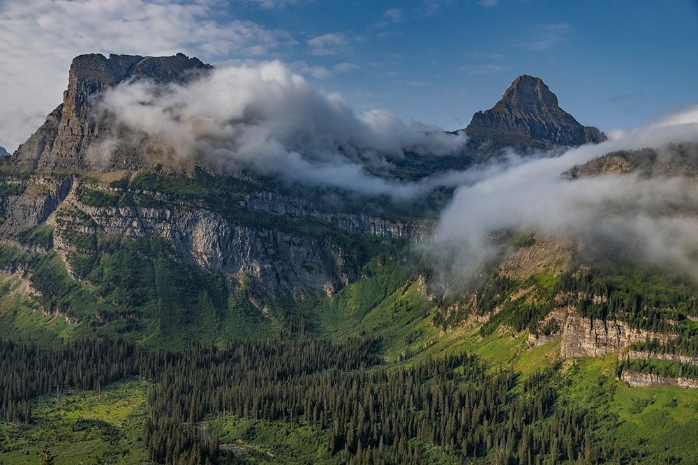 Rolling fog clouds with Heavy Runner and Reynold Mountains at Logan Pass in Glacier National Park art print by Chuck Haney for $57.95 CAD