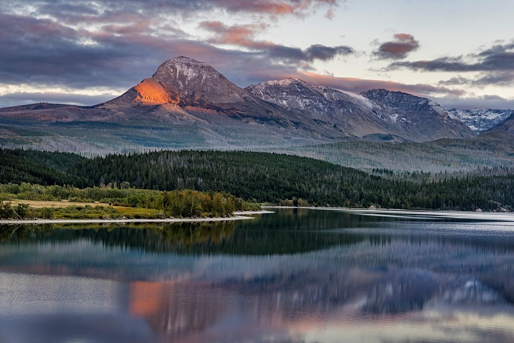 Mountain catches alpenglow light at sunset over St. Mary Lake-Glacier National Park-Montana-USA art print by Chuck Haney for $57.95 CAD