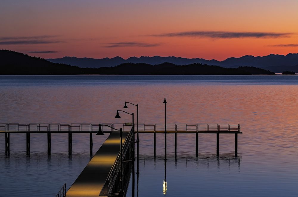 Dock at dawn on Flathead Lake in Polson, Montana, USA. art print by Chuck Haney for $57.95 CAD