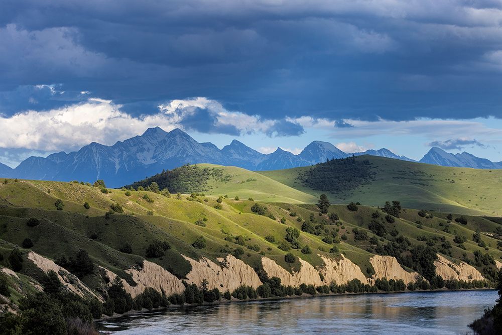 Clay cliffs along the Flathead River with Mission Mountains near Ronan, Montana, USA. art print by Chuck Haney for $57.95 CAD