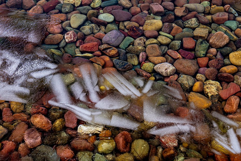 Ice formations above the rocks along the shore of Lake McDonald in Glacier NP, Montana, USA. art print by Chuck Haney for $57.95 CAD