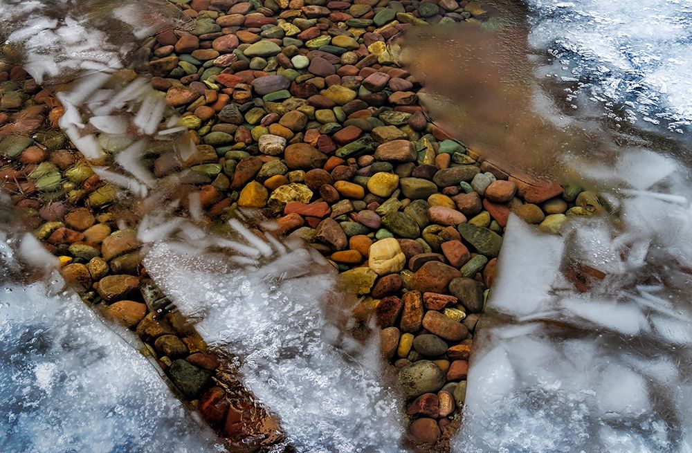 Ice formations above the rocks along the shore of Lake McDonald in Glacier NP, Montana, USA. art print by Chuck Haney for $57.95 CAD