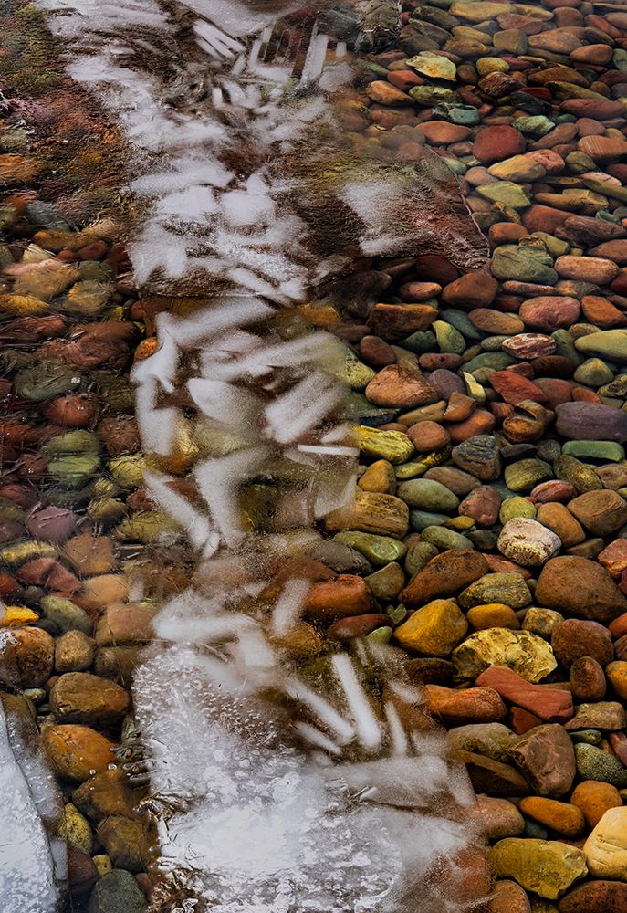 Ice formations above the rocks along the shore of Lake McDonald in Glacier NP, Montana, USA. art print by Chuck Haney for $57.95 CAD