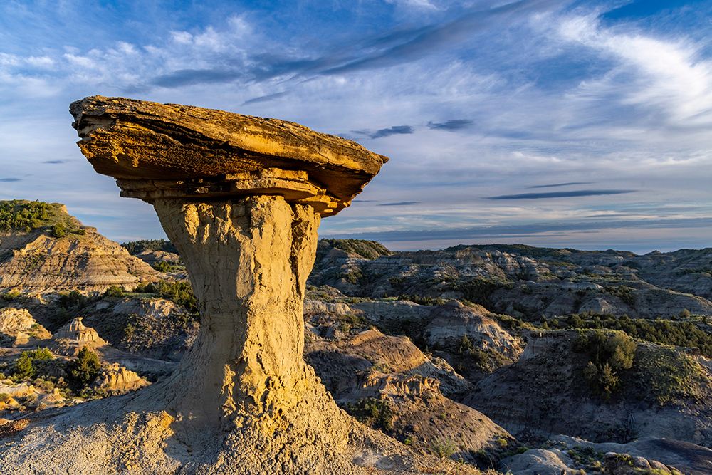 Caprock formation in the badlands of Makoshika State Park in Glendive, Montana, USA. art print by Chuck Haney for $57.95 CAD