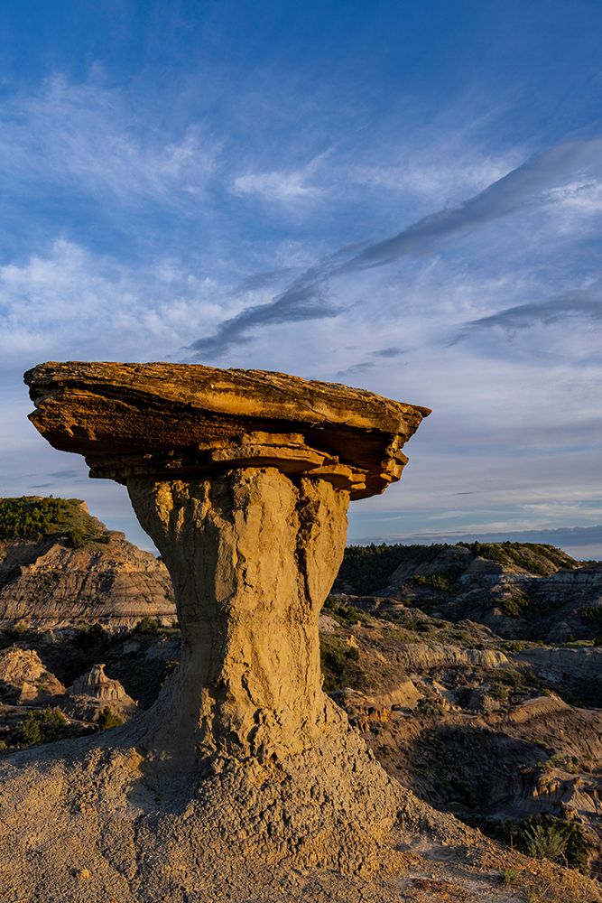Caprock formation in the badlands of Makoshika State Park in Glendive, Montana, USA. art print by Chuck Haney for $57.95 CAD