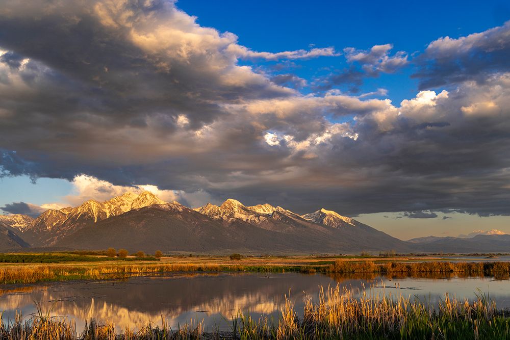 Wetlands pond reflects the Mission Mountains at sunset at Ninepipe NWR near Ronan, Montana, USA. art print by Chuck Haney for $57.95 CAD