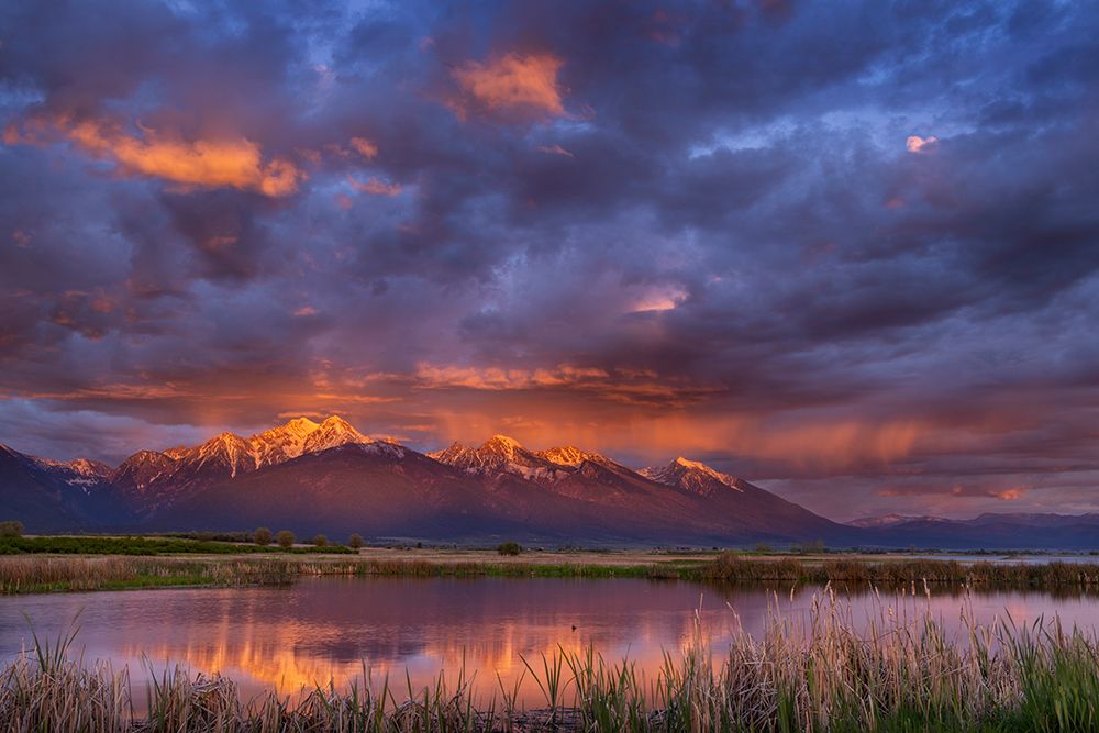 Wetlands pond reflects the Mission Mountains at sunset at Ninepipe NWR near Ronan, Montana, USA. art print by Chuck Haney for $57.95 CAD