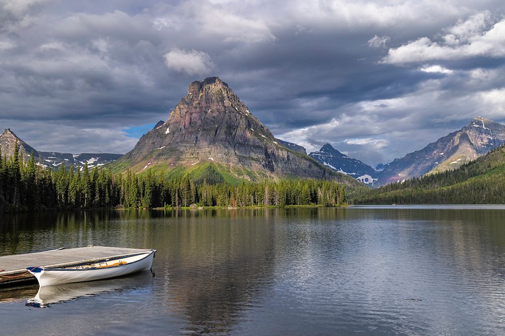 Canoe along Two Medicine Lake in Glacier National Park, Montana, USA. art print by Chuck Haney for $57.95 CAD