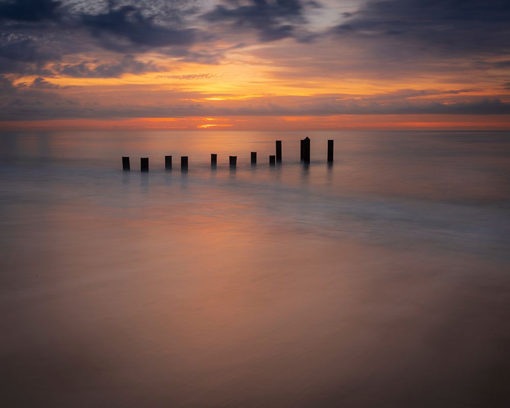 USA-New Jersey-Cape May National Seashore Sunrise on pier posts on ocean shore art print by Jaynes Gallery for $57.95 CAD