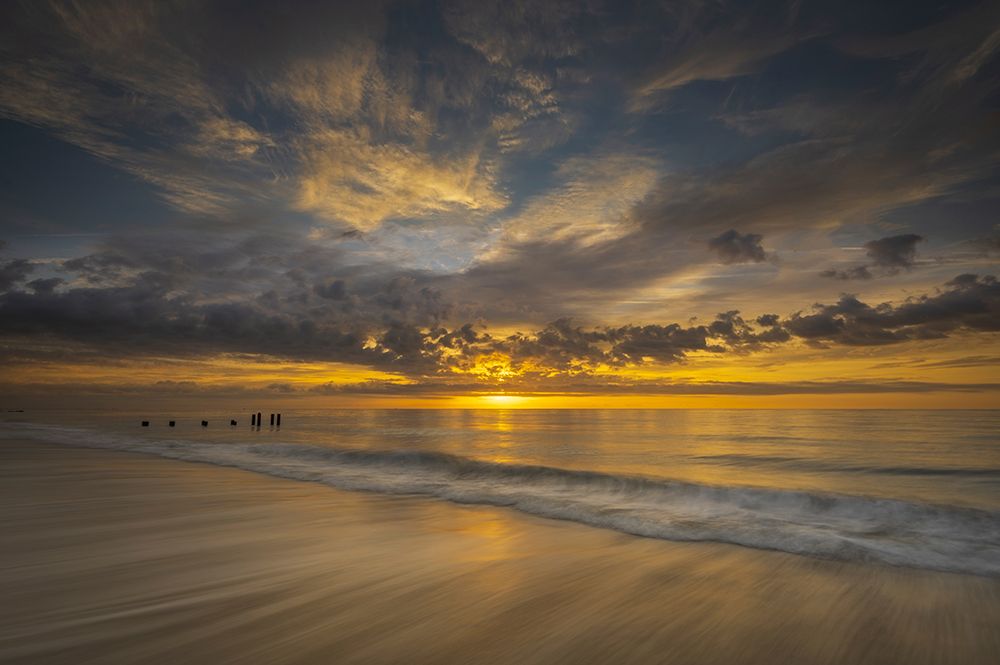 USA-New Jersey-Cape May National Seashore Sunrise on pier posts on ocean shore art print by Jaynes Gallery for $57.95 CAD