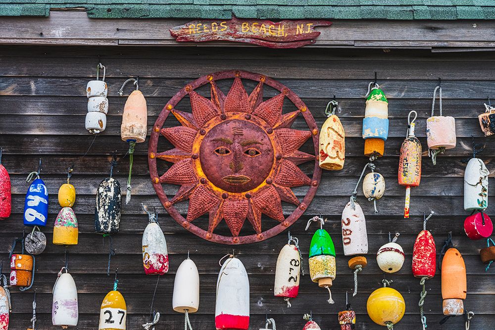 USA, New Jersey. Fishing floats and sun disc as wall decorations. art print by Jaynes Gallery for $57.95 CAD