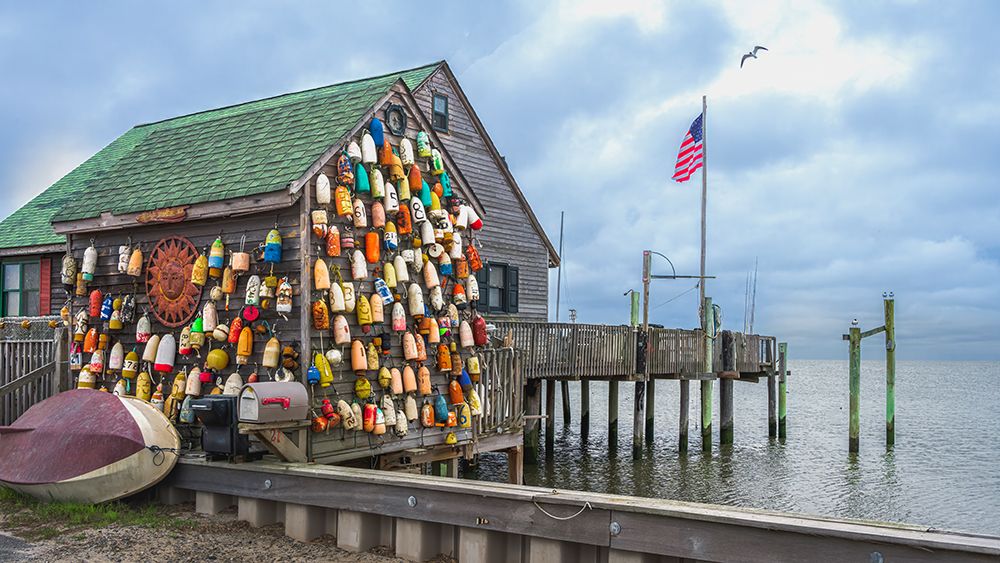 USA, New Jersey. Fishing floats and sun disc as wall decorations. art print by Jaynes Gallery for $57.95 CAD