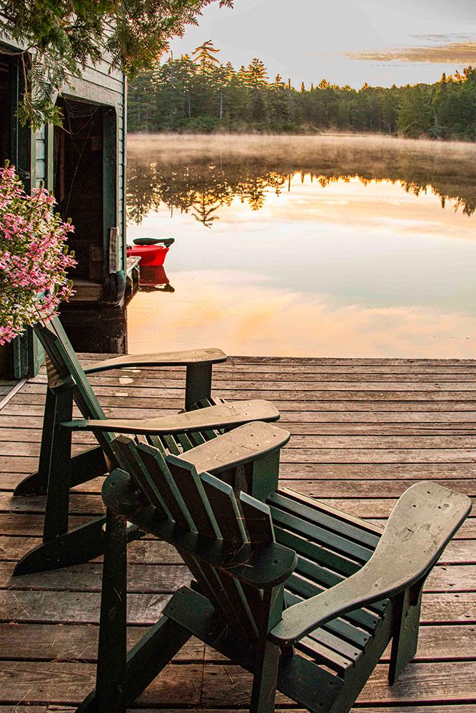 USA, New York. Adirondack Park, Saranac Lake, Hoel Pond, Adirondack chairs on boathouse dock. art print by Alison Jones for $57.95 CAD