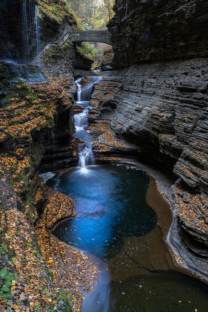 USA, New York. Series of waterfalls and bridge in Watkins Glen State Park. art print by Howie Garber for $57.95 CAD