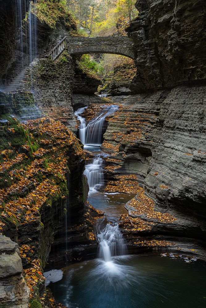 USA, New York. Series of waterfalls and bridge in Watkins Glen State Park. art print by Howie Garber for $57.95 CAD