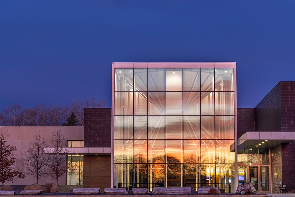 Sunrise glows on the North Dakota Heritage Center and State Museum in Bismarck, North Dakota, USA. art print by Chuck Haney for $57.95 CAD