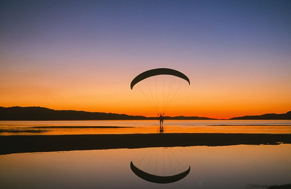Paraglider over the Great Salt Lake-Utah at sunset art print by Howie Garber for $57.95 CAD
