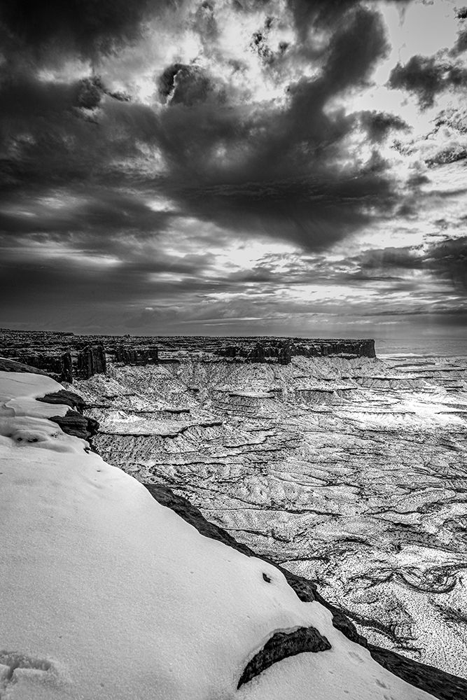A light snowfall and contrasting darker terrain, rugged landscape of Canyonlands National Park. art print by Larry Richardson for $57.95 CAD
