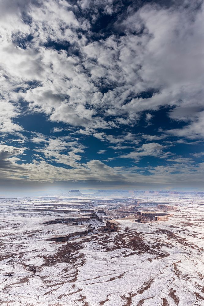 A light snowfall and contrasting orange-colored terrain,e rugged landscape of Canyonlands NP. art print by Larry Richardson for $57.95 CAD