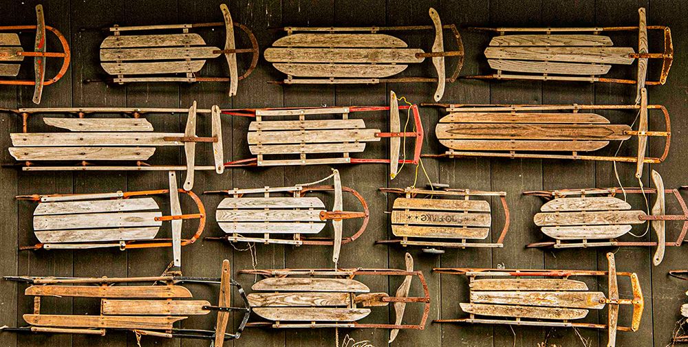 USA, Vermont. Side of barn mounted with old wooden sleds as decor. art print by Alison Jones for $57.95 CAD