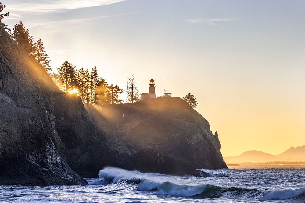 King tide waves crash into cliffs below Lighthouse at Cape Disappointment State Park in Washington art print by Chuck Haney for $57.95 CAD
