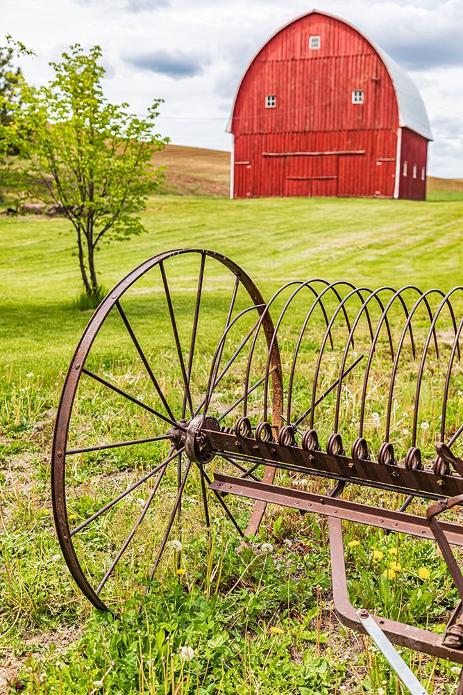Albion-Washington State-USA-Red barns and antique farm equipment in the Palouse hills art print by Emily Wilson for $57.95 CAD