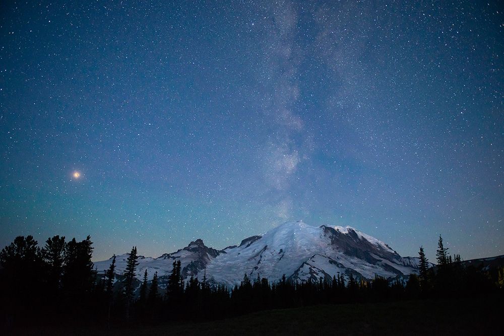 The lights of climbers can be seen on the mountain as the Milky Way rises behind Mt Rainier art print by Greg Probst for $57.95 CAD