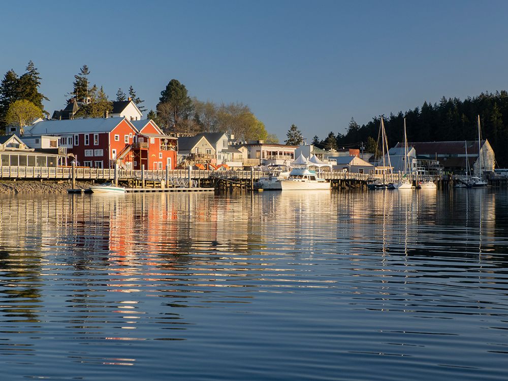 View of La Conner, Washington State, waterfront from the Swinomish Channel. art print by Merrill Images for $57.95 CAD