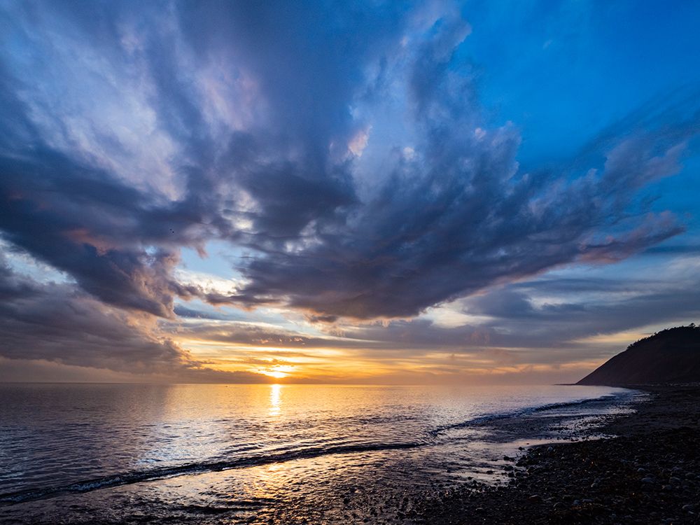Sunset sky reflected on water on beach. Whidbey Island, Washington State. art print by Merrill Images for $57.95 CAD