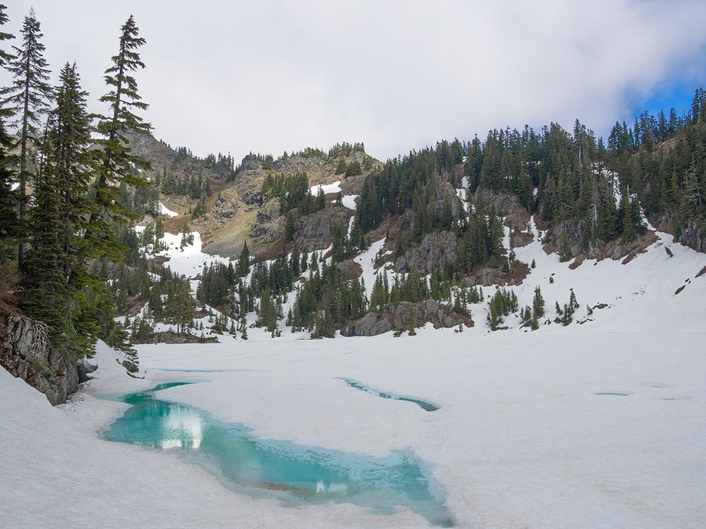Washington, USA. Mount Baker Snoqualmie NF, Lake Lilliam, partially melted out from winter snow. art print by Jamie and Judy Wild for $57.95 CAD