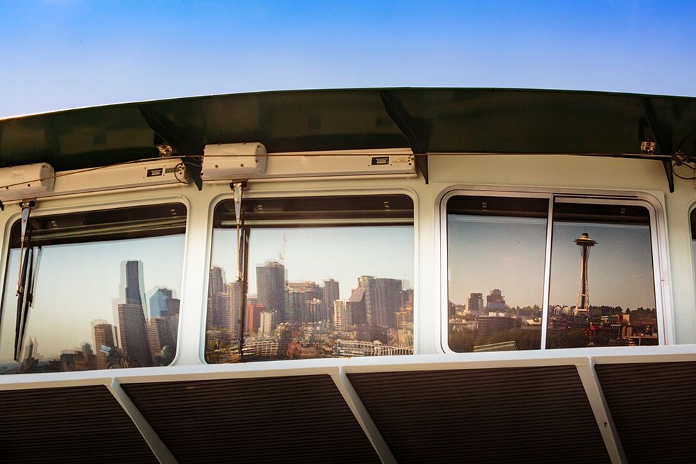 Reflection of Seattle skyline waterfront in ferry window, Washington State, USA. art print by Rob Casey for $57.95 CAD
