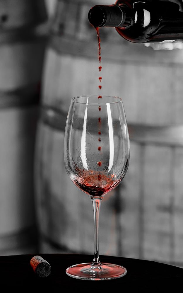 Red wine pouring into is captured in mid-air before it touches wine glass art print by Richard Duval for $57.95 CAD
