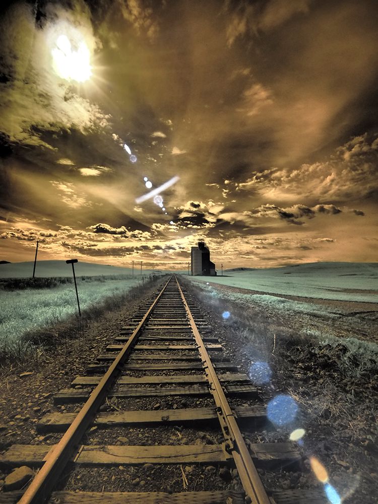 USA-Washington State-Palouse-Backcountry rail Road and Silo through wheat field with clouds art print by Terry Eggers for $57.95 CAD