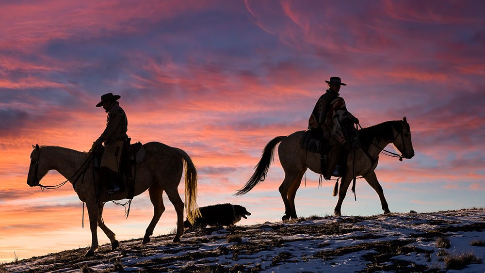 USA- Shell- Wyoming. Hideout Ranch cowgirls and dog silhouetted against sunsets sky. art print by Darrell Gulin for $57.95 CAD