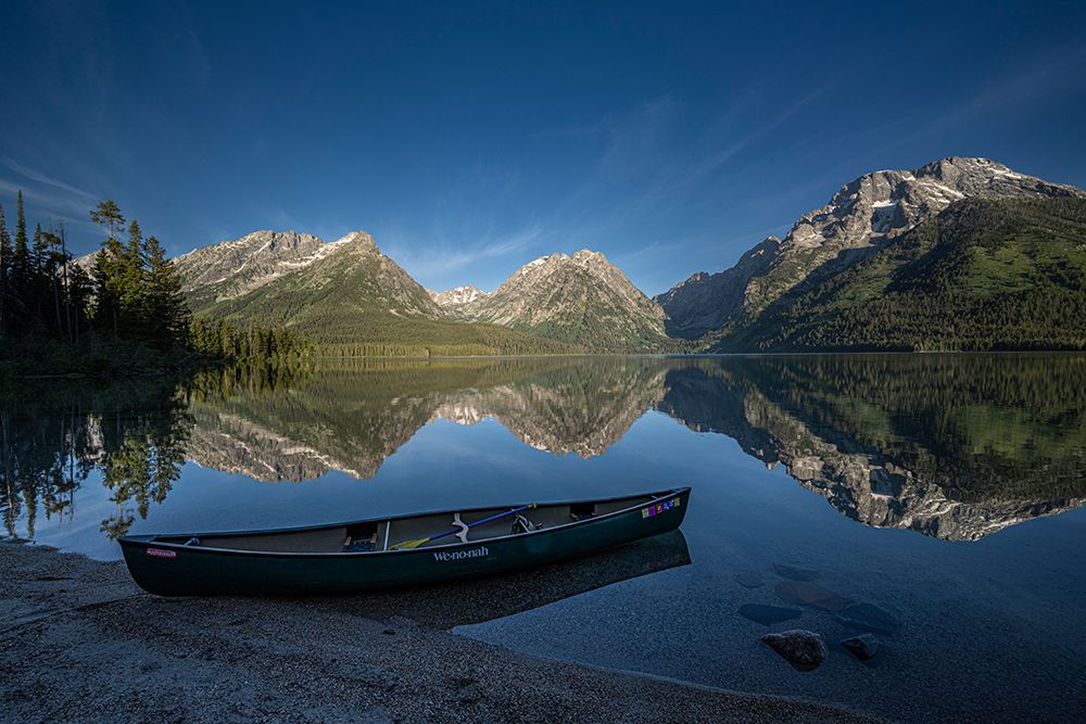 USA, Wyoming. Canoe and Mountains seen from Leigh Lake, Grand Teton National Park. art print by Howie Garber for $57.95 CAD